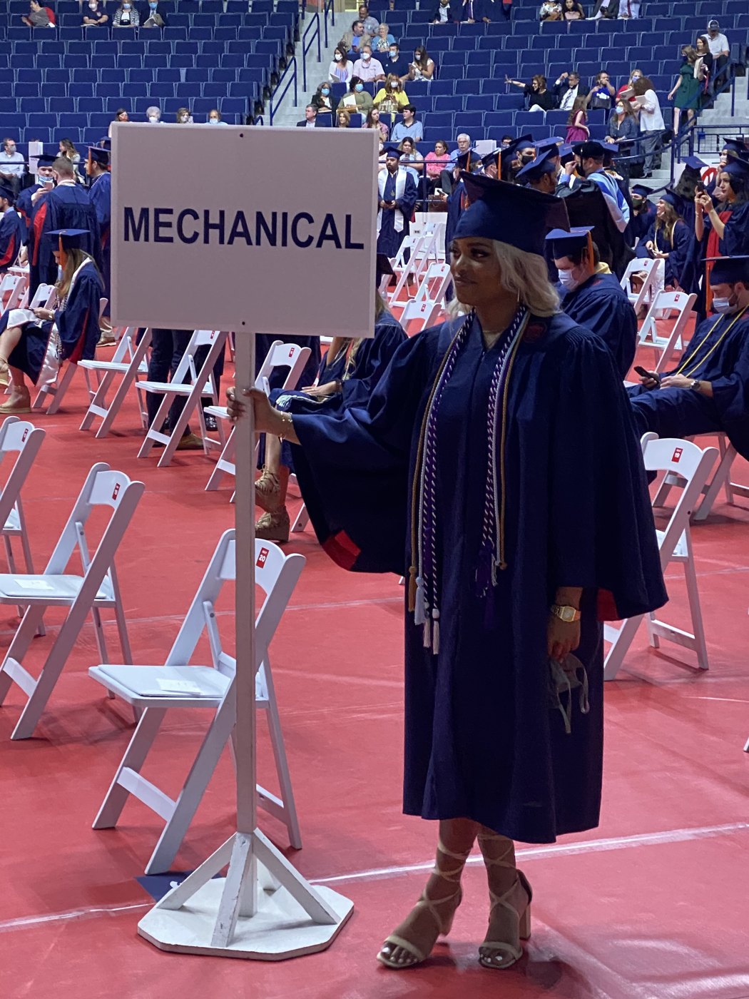 Amethyst Lowe carrying the Mechanical Engineering banner at the University of Mississippi commencement